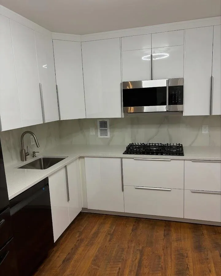 Restored kitchen with white cabinets after water damage in Logan